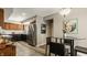 Cozy kitchen features stainless steel appliances, wood cabinets, and breakfast nook with glass table at 4428 Edinburgh Pt, Indianapolis, IN 46228