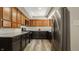 Modern kitchen features stainless steel refrigerator and range, along with shaker cabinets at 4428 Edinburgh Pt, Indianapolis, IN 46228