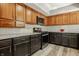 Well-equipped kitchen features stainless steel range, bright cabinets, and updated countertops at 4428 Edinburgh Pt, Indianapolis, IN 46228