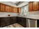 Bright kitchen with stainless steel appliances, window overlooking yard and shaker style cabinets at 4428 Edinburgh Pt, Indianapolis, IN 46228