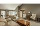 Open-concept living room with vaulted ceilings, hardwood floors, and inviting furnishings at 4428 Edinburgh Pt, Indianapolis, IN 46228