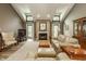 Bright living room featuring a fireplace, vaulted ceilings, and comfortable seating at 4428 Edinburgh Pt, Indianapolis, IN 46228