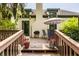 Wooden deck with patio furniture, plants, and outdoor grill at 4428 Edinburgh Pt, Indianapolis, IN 46228