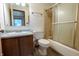 Cozy bathroom with a tub/shower combo and wooden vanity at 4428 Tucson Dr, Indianapolis, IN 46241