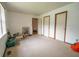 Bedroom with neutral carpet, white walls, and multiple closets at 4428 Tucson Dr, Indianapolis, IN 46241
