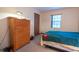 Bedroom featuring a dresser, a window, and a bed at 4428 Tucson Dr, Indianapolis, IN 46241