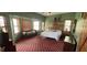 Cozy bedroom with natural light, wood trim, a decorative carpet, and decorative touches for a warm ambiance at 4849 S 500 E, Greenfield, IN 46140