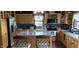 Well-appointed kitchen featuring custom wood cabinetry, stainless steel appliances, and a functional center island at 4849 S 500 E, Greenfield, IN 46140