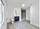 Modern bathroom featuring gray wood-look tile, blue vanity, and a walk-in shower at 4923 E University Ave, Indianapolis, IN 46201