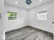 Well-lit bedroom featuring two windows providing views of the outdoors at 4923 E University Ave, Indianapolis, IN 46201