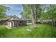 Beautiful backyard with a tree swing, fire pit, and screened-in porch at 5024 N Kenwood Ave, Indianapolis, IN 46208