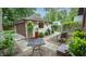 Charming backyard patio area, featuring outdoor furniture and a barbecue grill at 5024 N Kenwood Ave, Indianapolis, IN 46208
