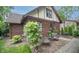Charming backyard with patio furniture, landscaping, and lush greenery at 5024 N Kenwood Ave, Indianapolis, IN 46208
