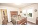 Cozy bedroom featuring a large bed, ample natural light, and classic wood furnishings at 5024 N Kenwood Ave, Indianapolis, IN 46208
