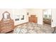 Bedroom featuring warm natural lighting, wood furnishings, and vintage decor at 5024 N Kenwood Ave, Indianapolis, IN 46208