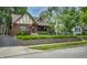 Charming Tudor-style home with brick facade, manicured landscaping, and inviting curb appeal at 5024 N Kenwood Ave, Indianapolis, IN 46208