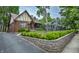 Quaint Tudor-style home with brick exterior, lovely yard, and charming curb appeal in a neighborhood setting at 5024 N Kenwood Ave, Indianapolis, IN 46208
