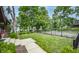 Front yard with a well-manicured lawn and landscaping, steps leading to the home, and a sidewalk at 5024 N Kenwood Ave, Indianapolis, IN 46208