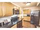 Well-lit kitchen equipped with stainless steel appliances and ample cabinetry at 5024 N Kenwood Ave, Indianapolis, IN 46208