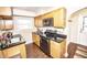 Kitchen features ample counter space, wood cabinets and stainless steel appliances at 5024 N Kenwood Ave, Indianapolis, IN 46208