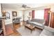 Inviting living room with hardwood floors, arched doorway, and ample seating at 5024 N Kenwood Ave, Indianapolis, IN 46208