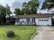 Charming single-story home with a well-maintained front yard, blue shutters, and attached garage at 516 Memorial Dr, Edinburgh, IN 46124