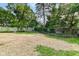 Large backyard with wooden fences and landscaping at 5884 Compton St, Indianapolis, IN 46220