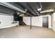 Spacious basement with painted walls and ceiling with the stairs in view at 5884 Compton St, Indianapolis, IN 46220