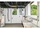 Basement with a utility sink and windows at 5884 Compton St, Indianapolis, IN 46220