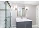 Bathroom featuring updated vanity, modern fixtures and a shower at 5884 Compton St, Indianapolis, IN 46220