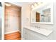 Bathroom featuring a shower, vanity with marble countertop, and a walk-in closet at 5884 Compton St, Indianapolis, IN 46220