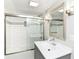 Tastefully updated bathroom featuring a tub-shower combo and modern vanity at 5884 Compton St, Indianapolis, IN 46220