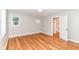 Bedroom featuring hardwood floors, neutral paint, and a closet with an open door at 5884 Compton St, Indianapolis, IN 46220