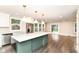 Spacious kitchen featuring a center island, stainless steel appliances, and ample natural light at 5884 Compton St, Indianapolis, IN 46220