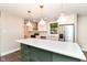Bright kitchen featuring an island, stainless steel appliances, and modern finishes at 5884 Compton St, Indianapolis, IN 46220