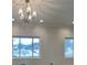 Bright living room featuring recessed lighting and scenic neighborhood views from large windows at 5939 Brendonridge S Ct, Indianapolis, IN 46226