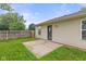 Backyard with a concrete patio, grass, and a wood fence at 6227 Long River Ln, Indianapolis, IN 46221