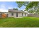 Backyard with a grass, wood fence, and the rear of the home at 6227 Long River Ln, Indianapolis, IN 46221