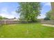 Large, grassy backyard enclosed by a tall wooden fence at 6227 Long River Ln, Indianapolis, IN 46221