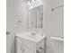 Well-lit bathroom showcasing a vanity sink with modern fixtures and a large mirror at 6227 Long River Ln, Indianapolis, IN 46221
