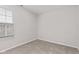 Spacious bedroom featuring neutral carpeting, a window, and ample natural light at 6227 Long River Ln, Indianapolis, IN 46221