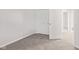 Bedroom with light gray carpet, white walls, and a closet with folding doors at 6227 Long River Ln, Indianapolis, IN 46221