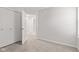 Bedroom showcasing light gray carpet and white walls, closet with folding doors visible at 6227 Long River Ln, Indianapolis, IN 46221