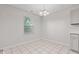 Bright dining area with tile flooring, modern lighting, and a view of the window at 6227 Long River Ln, Indianapolis, IN 46221