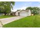 Charming single-story home with a well-maintained lawn and a long driveway at 6227 Long River Ln, Indianapolis, IN 46221