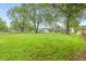 Expansive backyard with mature trees, perfect for outdoor activities and relaxation at 6310 Kellum Dr, Indianapolis, IN 46221