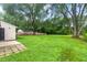 Expansive backyard with mature trees, perfect for outdoor activities and relaxation at 6310 Kellum Dr, Indianapolis, IN 46221