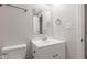 Bathroom with white vanity, faucet, and toilet at 6310 Kellum Dr, Indianapolis, IN 46221