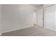 Bedroom features carpet, closet, and view to adjacent hallway at 6310 Kellum Dr, Indianapolis, IN 46221