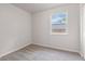 Bright bedroom features neutral walls and carpet, window with blinds at 6310 Kellum Dr, Indianapolis, IN 46221